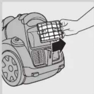 Line drawing of a hand inserting a grid into a device component (no text or symbols).
