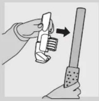 Illustration of a hand holding a tool with a magnifying glass, next to a cylindrical object (no text or symbols present)