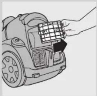 Line drawing of a hand inserting a grid into a device component.