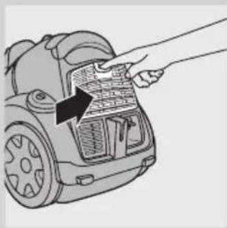 Line drawing of a hand inserting a component into a car's door panel (no text or symbols).