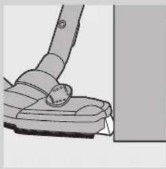 Close-up of a vacuum cleaner's head and arm, showing mechanical components and mounting bracket (no text or symbols visible).