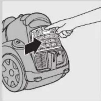 Line drawing of a hand inserting a component into a vacuum cleaner's air vent (no text or symbols).
