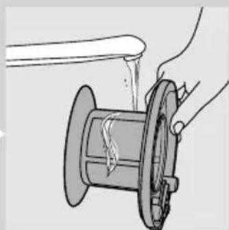 Illustration of a hand pouring liquid into a mechanical component.