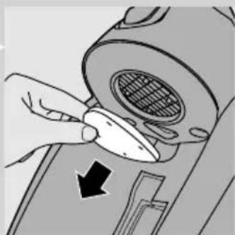 Illustration of a hand using a tool to adjust or install a component.