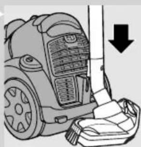 Illustration of a vacuum cleaner next to a cloth, showing mechanical components and a downward arrow (no text or symbols)