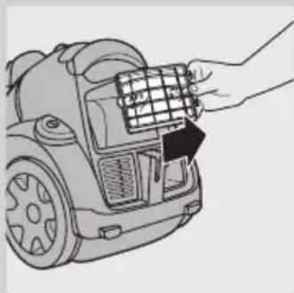 Line drawing of a hand inserting a grid into a device component (no text or symbols).