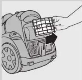 Line drawing of a hand inserting a grid into a device component (no text or symbols).