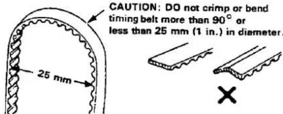 CAUTION: DO not crimp or bend timing belt more than 90° or less than 25 mm (1 in.) in diameter. 25 mm