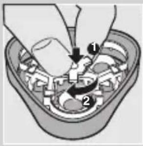 Diagram showing a mechanical assembly with labeled parts and directional arrows indicating motion or force