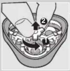 Diagram showing mechanical assembly with labeled parts and directional arrows, likely illustrating a gear or mechanism process.