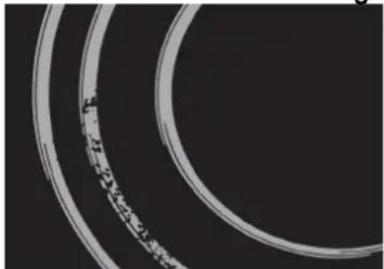Close-up of a circular metallic ring with visible inner bands (no text or symbols)