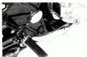 Close-up of a motorcycle's front wheel and side-mounted sensor (no visible text or symbols)