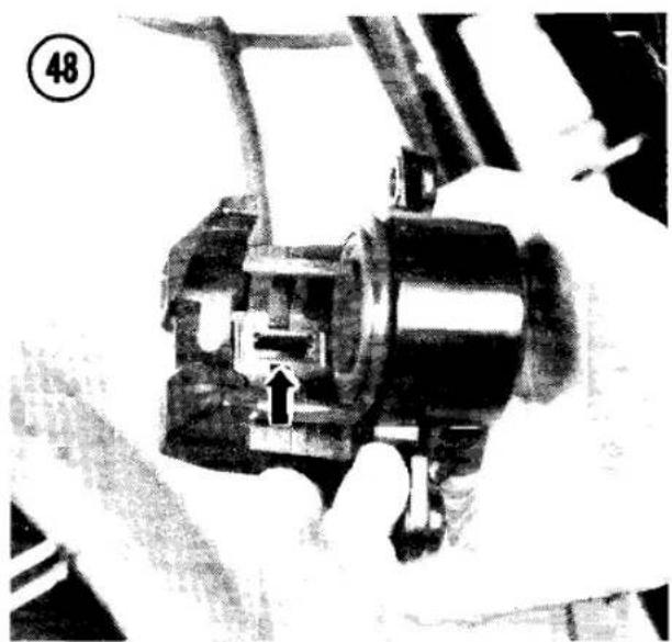Close-up of hands operating a mechanical device with no visible text or symbols