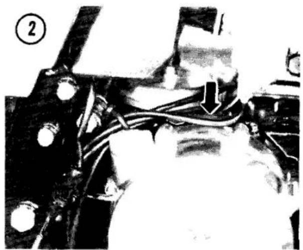 Close-up of a mechanical component with wires and connectors, no visible text or symbols