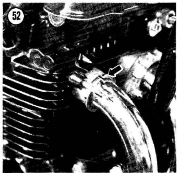 Close-up of a mechanical component with ribbeds and a curved pipe, no visible text or symbols