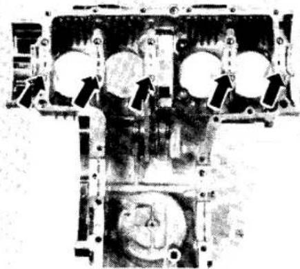 Close-up of an internal combustion engine cylinder head with piston and crankshaft (no visible text or labels)