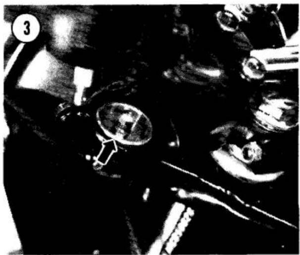 Close-up of mechanical components and tools in a workshop setting (no visible text or symbols)