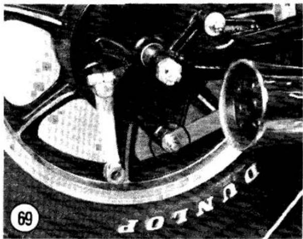 Close-up of a bicycle wheel with visible mechanical components and no readable text or symbols