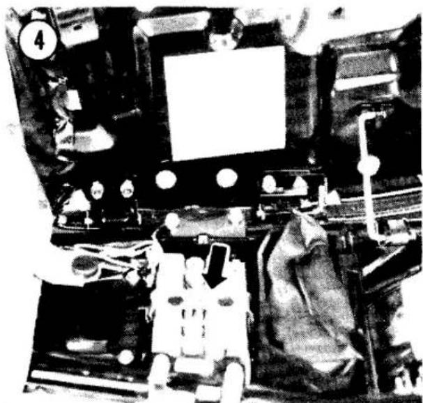 Interior view of a mechanical or electronic device with visible circuitry and components (no readable text or symbols)