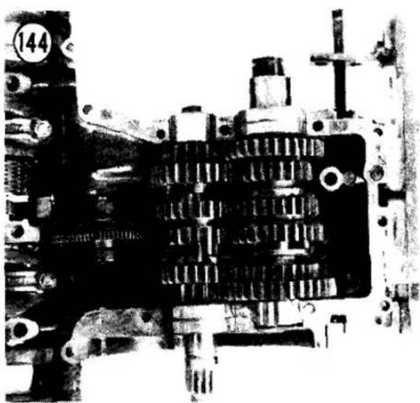 Close-up of a mechanical component with gears and bolts (no visible text or symbols)