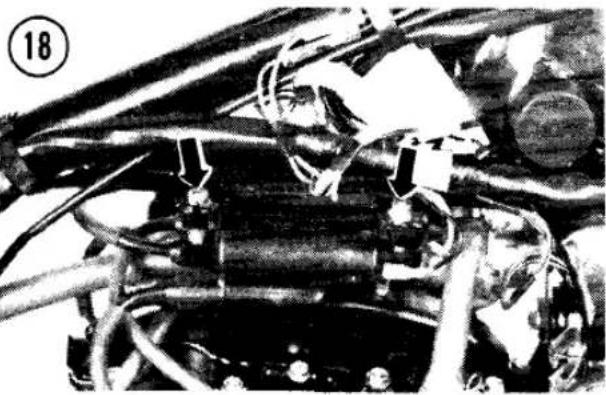 Close-up of an engine bay with visible hoses and components (no text or symbols)