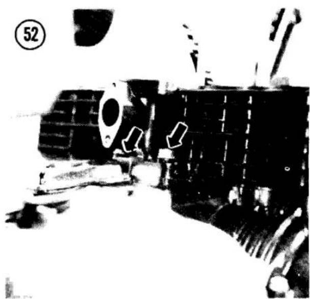 Black-and-white photo of a military vehicle with visible tracks and equipment, marked with arrows (no readable text or symbols)