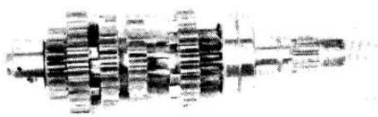Mechanical gear assembly diagram showing shafts and gears (no text or labels)