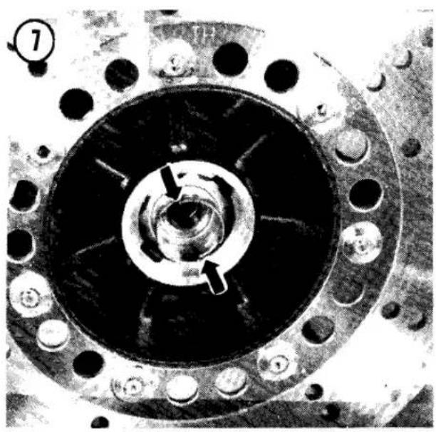 Close-up of a mechanical component with central bore and flanged ends, no visible text or symbols