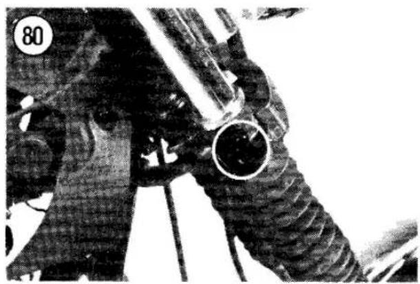 Close-up of a mechanical component with textured surfaces and a circular opening, no visible text or symbols