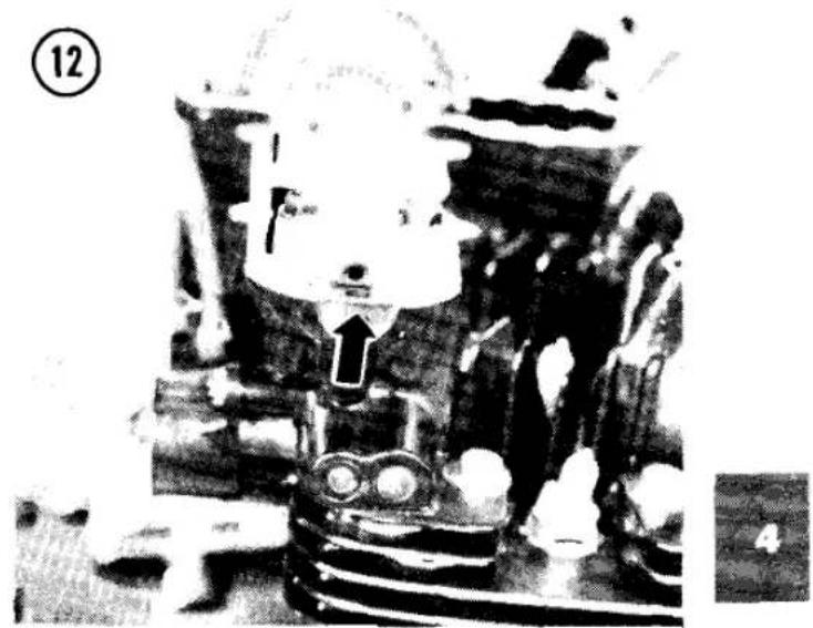 Black-and-white photo of a cartoon character in a suit with a large arrow pointing to his head, standing beside a vehicle (no visible text or symbols)