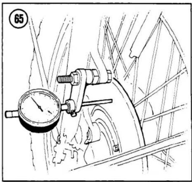 Technical line drawing of a mechanical device with a pressure gauge and lever mechanism (no text or symbols)