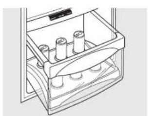 Line drawing of a drawer containing four cylindrical objects, no text or symbols present