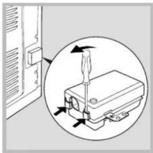 Diagram showing a screwdriver inserted into a device, with arrows indicating direction (no text or symbols present)