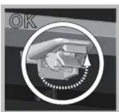 Close-up of a mechanical component with a circular outline and dotted pattern, no visible text or symbols