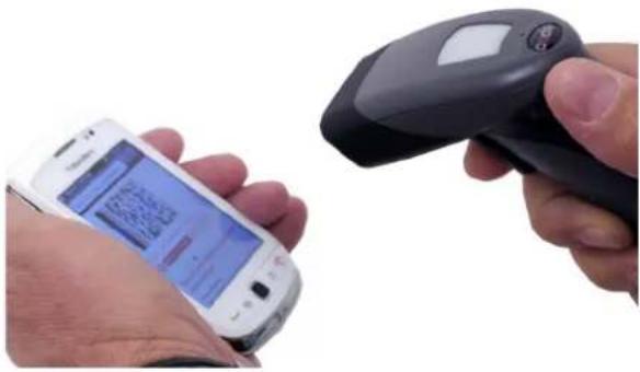 Close-up of a hand holding a smartphone displaying a QR code, with another hand scanning the device via a handheld scanner.