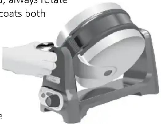 Hand operating a mechanical device with a circular component, no visible text or symbols