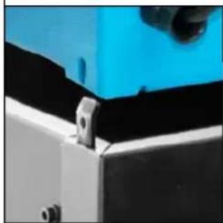 Close-up of a mechanical component with blue and black surfaces, no visible text or symbols