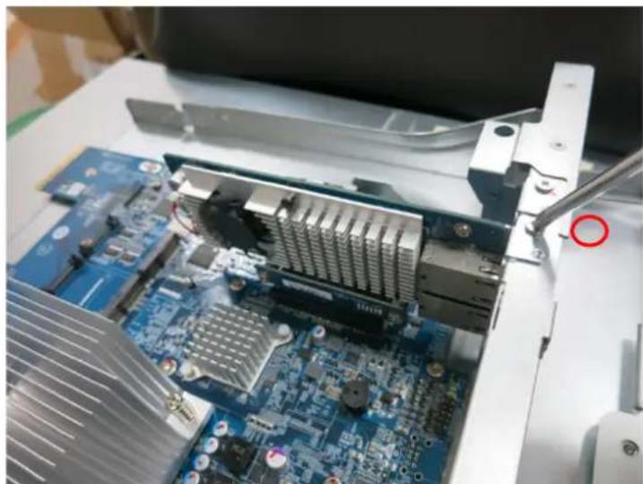 Close-up of an open computer motherboard with visible cooling and heat sinks, no text or symbols present.