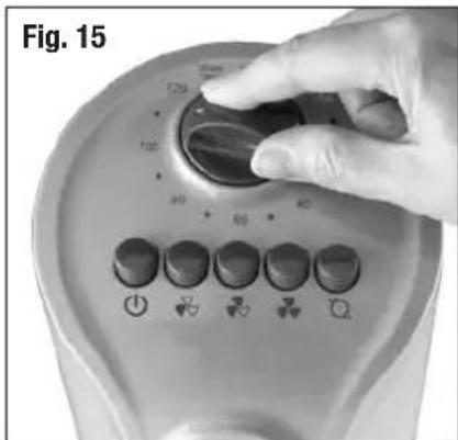 Close-up of a hand adjusting a circular control dial with switches and icons (no readable text or symbols)