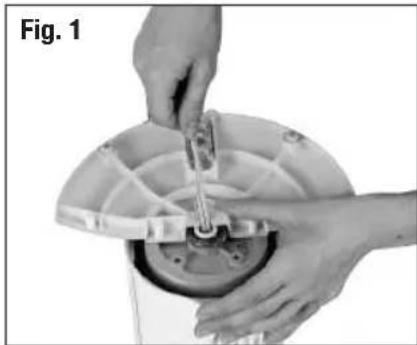 Close-up of hands assembling a mechanical component, no visible text or symbols