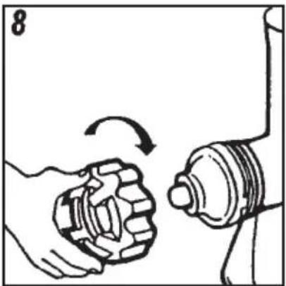 Illustration of a hand turning a gear with an arrow indicating rotational motion (no text or symbols)