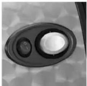 Close-up of a circular mechanical component with two glossy surfaces and a central hole (no text or symbols visible)