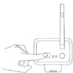 Line drawing of a hand inserting a device into a device with a pen (no text or symbols)