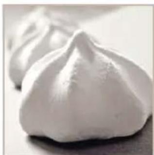 Close-up of white dumplings on a surface (no text or symbols visible)