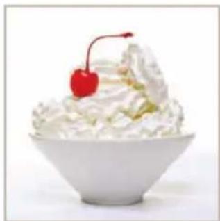 White bowl of whipped cream with a cherry on top (no text or symbols visible)