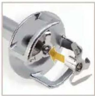 Close-up of a metallic mechanical component with a yellow arrow indicating a specific part (no visible text or symbols)