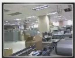 Interior view of a busy office or trading floor with multiple workstations and equipment (no visible text or signage)