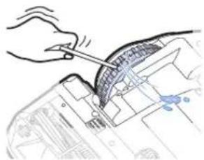 Hand using a tool to adjust or install a mechanical component (no visible text or symbols)