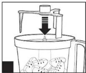 Diagram of a food processing machine with a downward arrow and waste sorting into a container (no text or symbols)