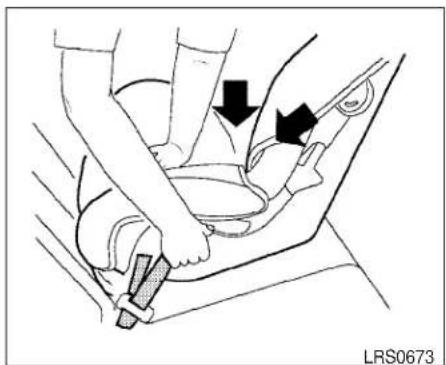 Medical illustration showing a hand using a bucklebelt to adjust the seat area (no text or symbols present)